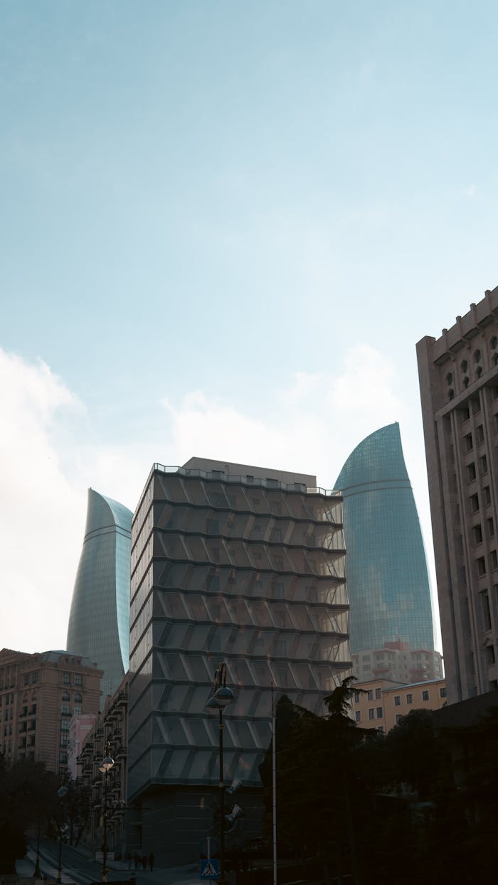 services-03 Skyline view highlighting Flame Towers and contemporary buildings in Baku, Azerbaijan.